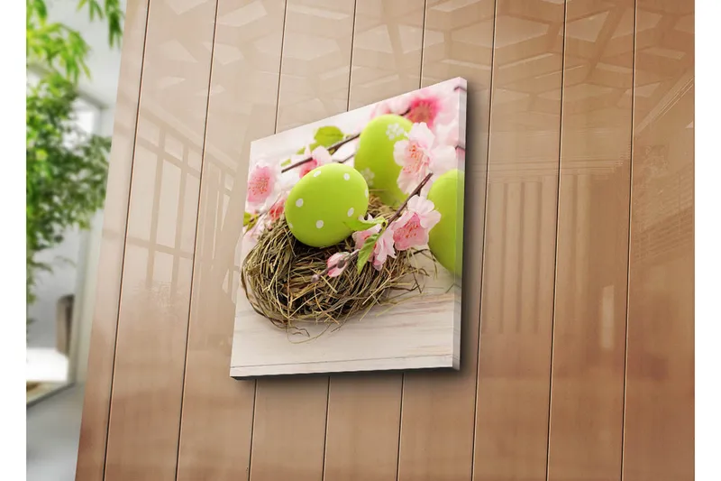 Canvas-taulu 45x45 cm - Reheviä pääsiäismunia pesässä kukkien ympäröimänä, Vihreä / Vaaleanpunainen / Ruskea