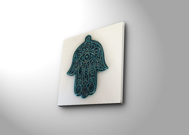 Canvas-taulu 45x45 cm - Symbolinen käsi silmällä ja monimutkaisilla kuvioilla, Turkoosi / Valkoinen