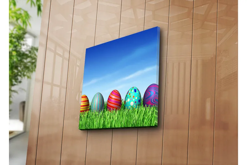 Canvas-taulu 45x45 cm - Värikkäät pääsiäismunat vihreällä nurmikolla, Vihreä / Sininen / Punainen