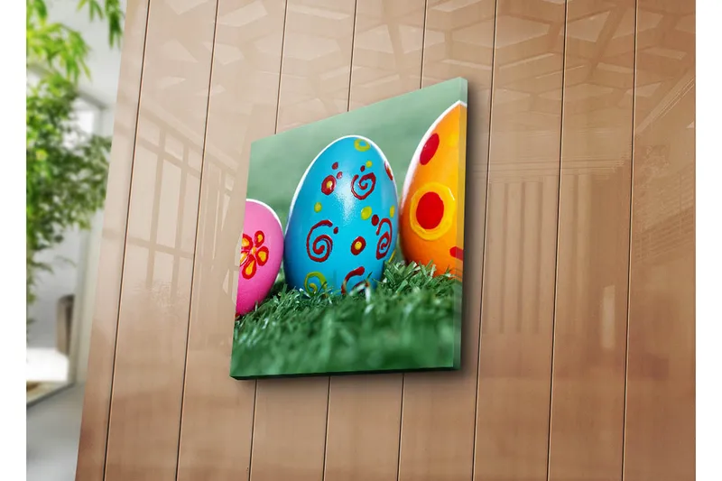 Canvas-taulu 45x45 cm - Värikkäät pääsiäismunat vihreällä nurmikolla, Sininen / Vaaleanpunainen / Keltainen