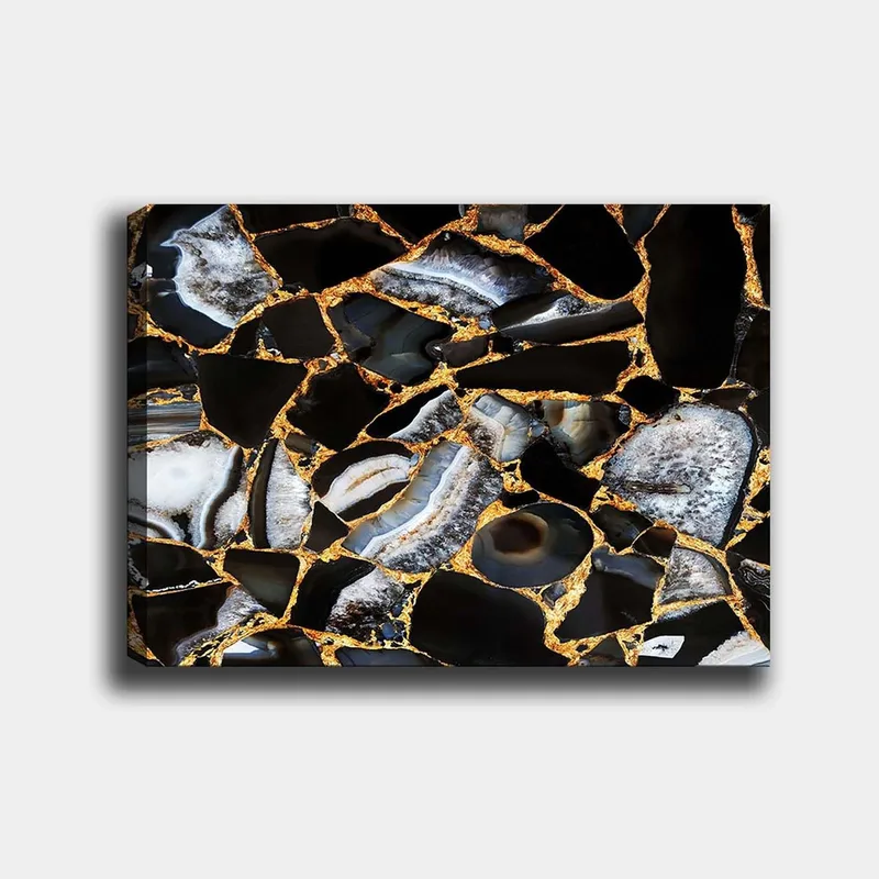 Canvas taulu 70x100 cm - Abstrakti taideteos, jossa on mustia ja harmaita kiviä sekä kultaisia elementtejä, Musta / Harmaa / Kulta