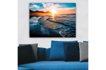 Canvas taulu 70x100 cm - Auringonlasku rannalla lempeiden aaltojen vyöryessä kohti rannikkoa - Sininen / Oranssi / Turkoosi - Sisustustuotteet - Taulu & taide - Canvas-taulu