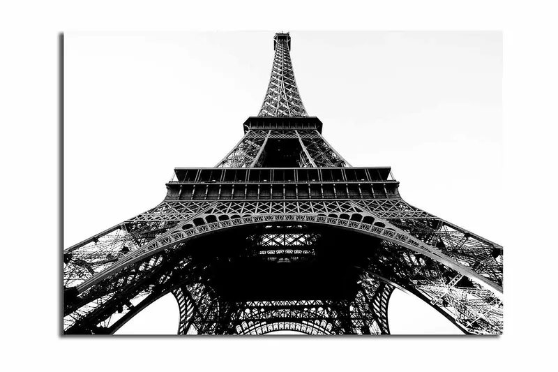 Canvas taulu 70x100 cm - Dramaattinen näkymä Eiffel-tornista alhaalta katsottuna, Musta / Valkoinen