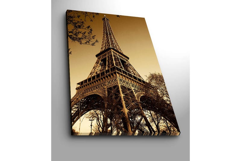 Canvas taulu 70x100 cm - Eiffel-torni dramaattisessa kulmassa, joka korostaa sen vaikuttavaa rakennetta - Kulta / Ruskea - Sisustustuotteet - Taulu & taide - Canvas-taulu