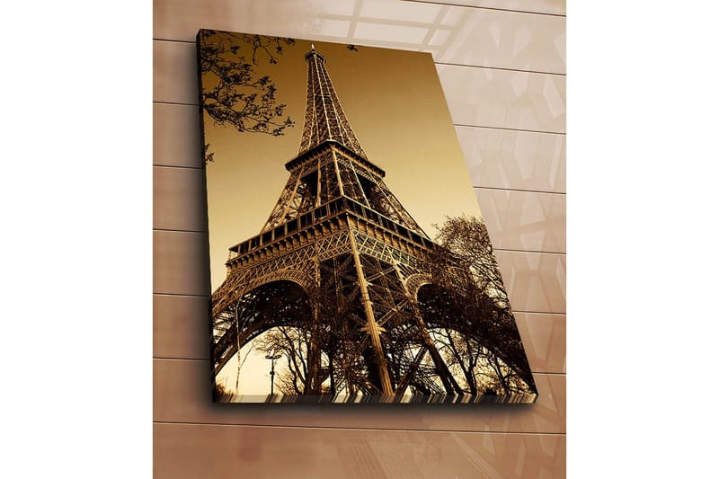 Canvas taulu 70x100 cm - Eiffel-torni dramaattisessa kulmassa, joka korostaa sen vaikuttavaa rakennetta - Kulta / Ruskea - Sisustustuotteet - Taulu & taide - Canvas-taulu