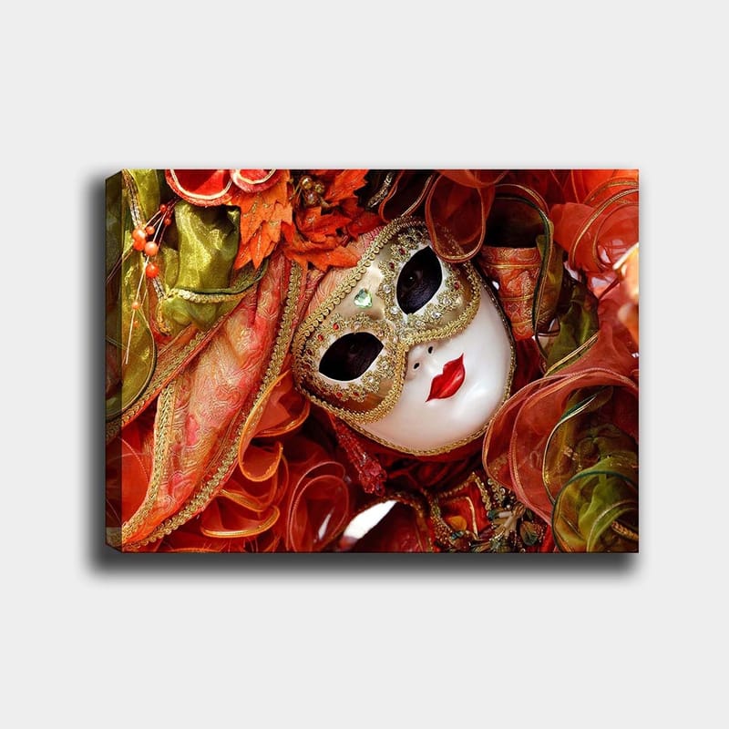 Canvas taulu 70x100 cm - Elegantti naamiaishahmo koristeellisella naamiolla ja värikkäällä asulla, Punainen / Oranssi / Vihreä