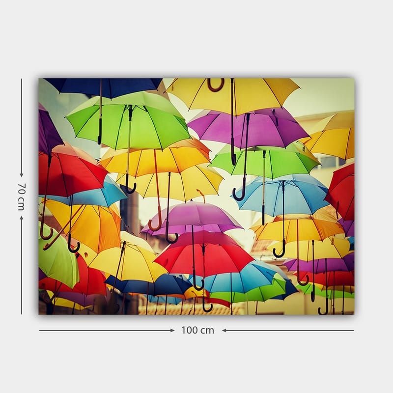Canvas taulu 70x100 cm - Ilmassa roikkuvat värikkäät sateenvarjot luovat eloisan ja leikkisän tunnelman - Vihreä / Keltainen / Punainen - Sisustustuotteet - Taulu & taide - Canvas-taulu
