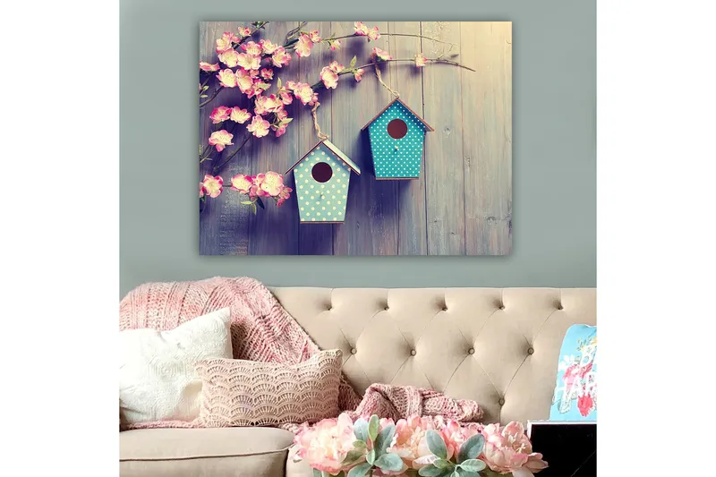 Canvas taulu 70x100 cm - Kaksi linnunpönttöä oksalla, taustalla kukkia, Vaaleanpunainen / Turkoosi