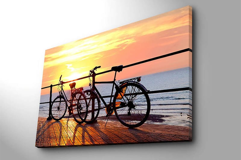 Canvas taulu 70x100 cm - Kaksi polkupyörää laiturilla auringonlaskun aikaan meren yllä - Oranssi / Musta / Keltainen - Sisustustuotteet - Taulu & taide - Canvas-taulu