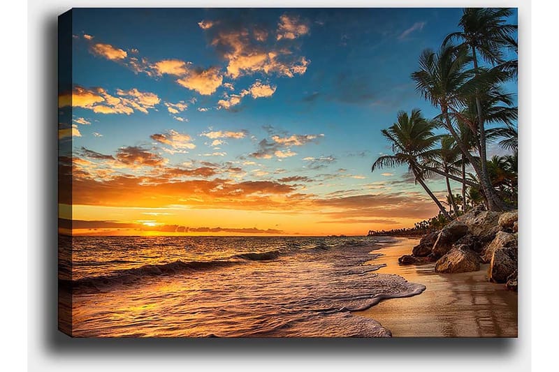 Canvas taulu 70x100 cm - Kaunis auringonlasku rannalla palmujen ja pehmeiden aaltojen vyöryessä hiekalle - Oranssi / Sininen / Beige - Sisustustuotteet - Taulu & taide - Canvas-taulu