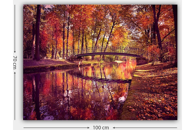 Canvas taulu 70x100 cm - Kaunis syysmaisema, jossa silta ylittää peilimäisen veden pinnan värikkäiden puiden ympäröimänä - Oranssi / Punainen / Keltainen - Sisustustuotteet - Taulu & taide - Canvas-taulu