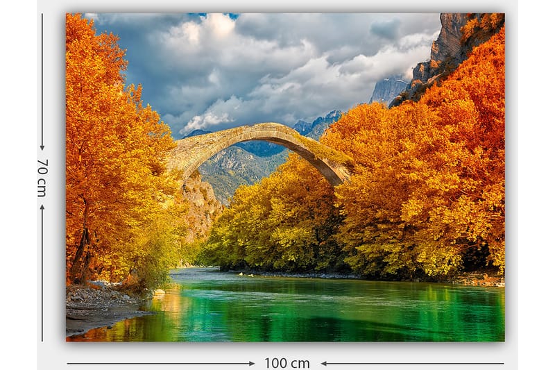 Canvas taulu 70x100 cm - Kaunis syysmaisema vanhalla kivisillalla, joka ylittää kimaltelevan joen värikkäiden puiden ympäröimänä - Oranssi / Vihreä / Sininen - Sisustustuotteet - Taulu & taide - Canvas-taulu