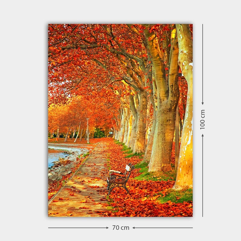 Canvas taulu 70x100 cm - Kaunis syysmaisema penkillä puiden reunustamalla kujalla, jossa on kimaltelevia punaisia ja oransseja lehtiä. - Punainen / Oranssi / Keltainen - Sisustustuotteet - Taulu & taide - Canvas-taulu