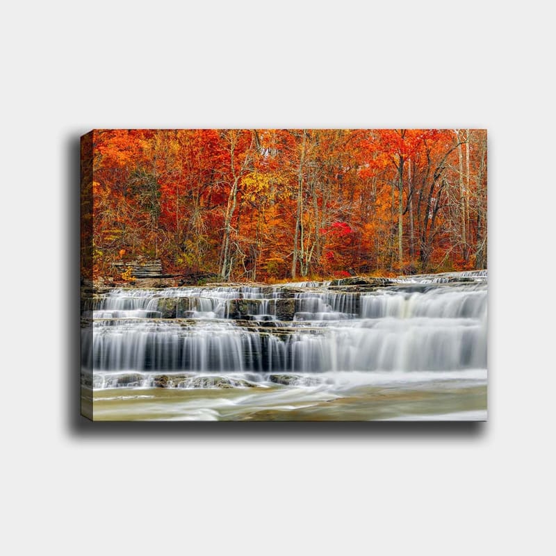 Canvas taulu 70x100 cm - Kaunis vesiputousmaisema syksyn väreissä punaisissa ja oransseissa sävyissä, Punainen / Oranssi / Harmaa