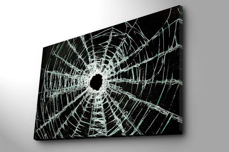 Canvas taulu 70x100 cm - Lähikuva säröilevästä lasiruudusta, jossa on keskellä reikä ja ulospäin ulottuvia halkeamia - Musta / Läpinäkyvä - Sisustustuotteet - Taulu & taide - Canvas-taulu