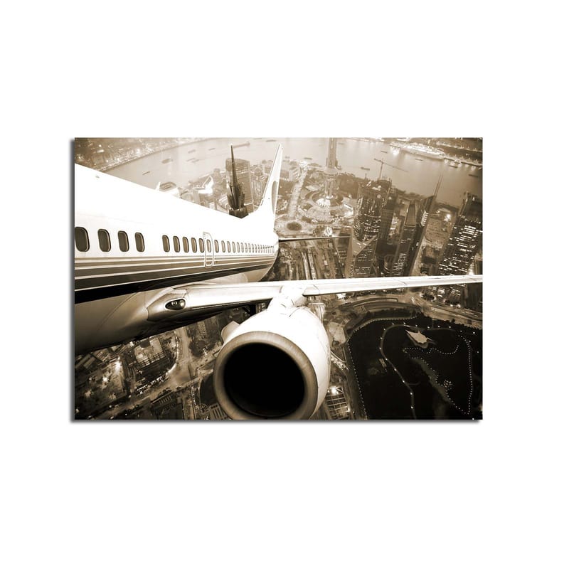 Canvas taulu 70x100 cm - Lentokone leijuu kaupungin yllä hämärässä - Musta / Valkoinen / Harmaa - Sisustustuotteet - Taulu & taide - Canvas-taulu