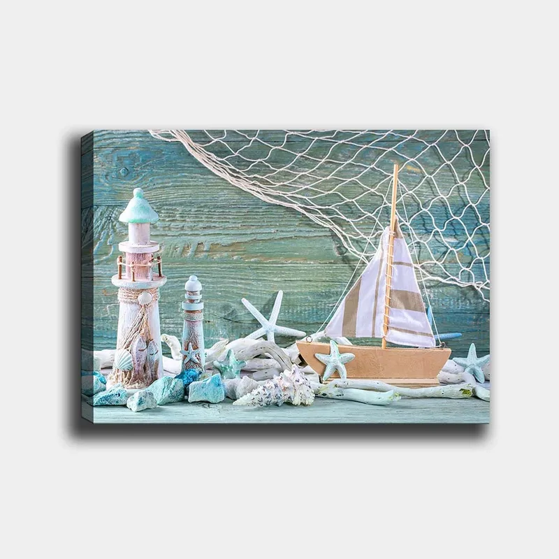 Canvas taulu 70x100 cm - Merimaisema purjeveneellä, majakalla ja meritähdellä rantamaisemissa - Sininen / Valkoinen / Beige - Sisustustuotteet - Taulu & taide - Canvas-taulu