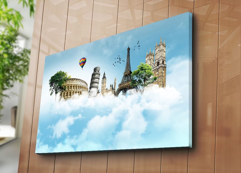 Canvas taulu 70x100 cm - Mielikuvituksellinen maisema kuuluisine rakennuksineen pilvien lomassa - Sininen / Vihreä / Valkoinen - Sisustustuotteet - Taulu & taide - Canvas-taulu