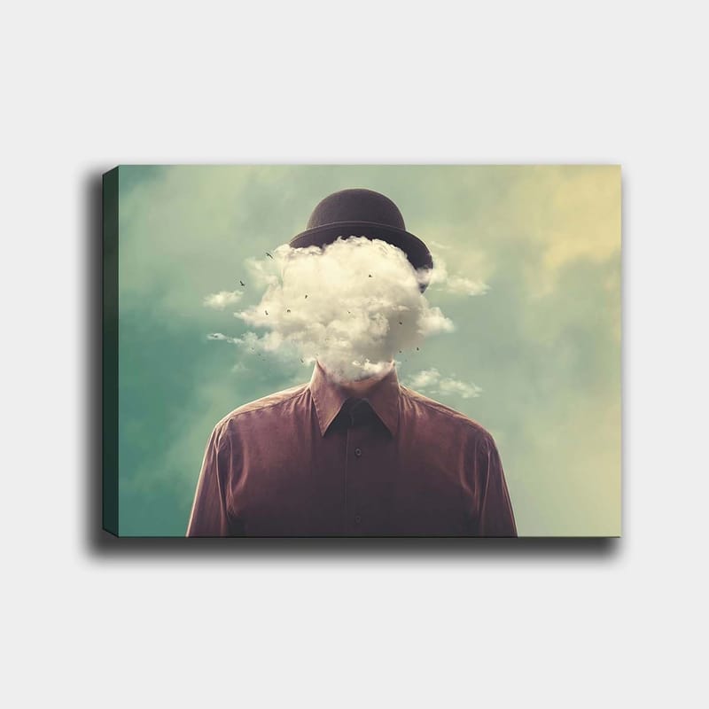 Canvas taulu 70x100 cm - Mies hatussa, jonka kasvot peittyvät pilvimuodostelmaan, Tummanruskea / Vaaleanharmaa / Vihreä
