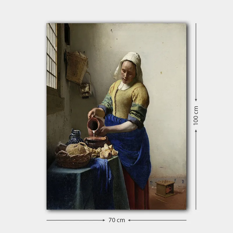 Canvas taulu 70x100 cm - Nainen kaatamassa maitoa kulhoon kirkkaassa keittiössä - Sininen / Keltainen / Ruskea - Sisustustuotteet - Taulu & taide - Canvas-taulu