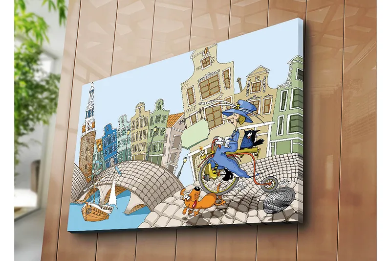 Canvas taulu 70x100 cm - Nainen polkupyörällä koiran ja kissan kanssa, värikkäiden talojen ja sillan ympäröimänä - Sininen / Vihreä / Oranssi - Sisustustuotteet - Taulu & taide - Canvas-taulu