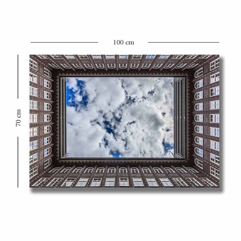 Canvas taulu 70x100 cm - Rakennuksen julkisivu, joka kehystää taivaan peilikuvan - Tummanruskea / Valkoinen / Vaaleansininen - Sisustustuotteet - Taulu & taide - Canvas-taulu