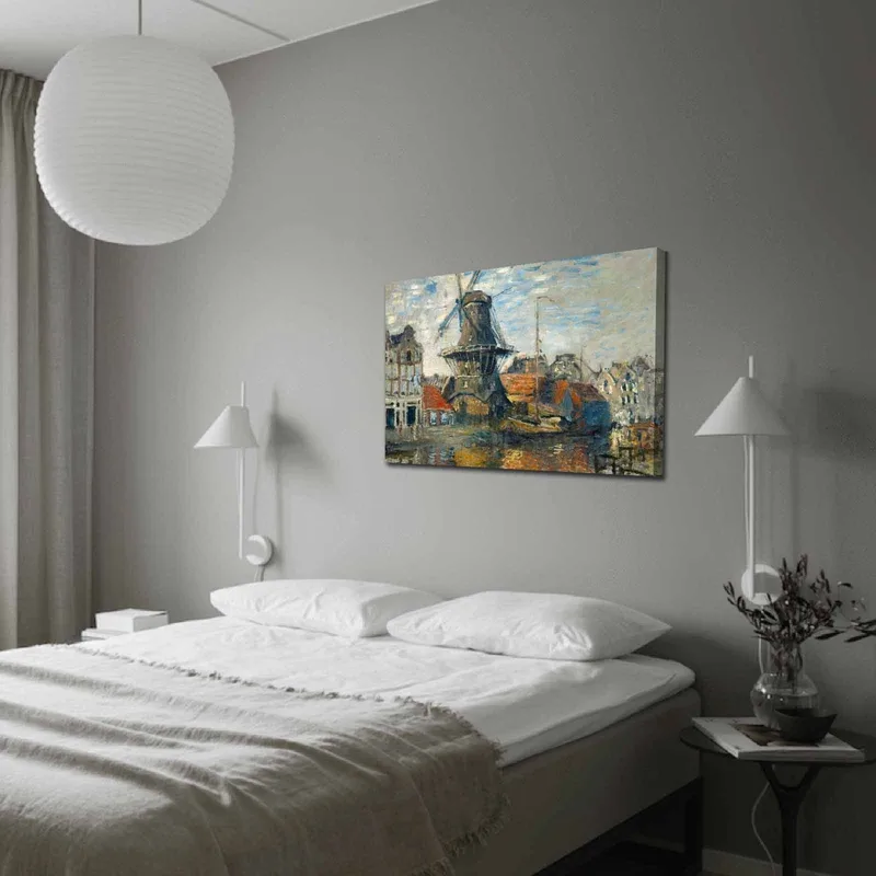 Canvas taulu 70x100 cm - Tuulimylly vesistön rannalla, viehättävien rakennusten ympäröimänä, Sininen / Vihreä / Oranssi