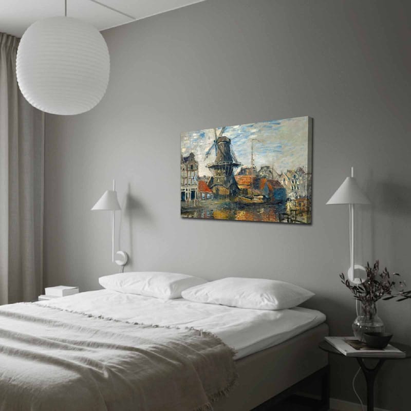 Canvas taulu 70x100 cm - Tuulimylly vesistön rannalla, viehättävien rakennusten ympäröimänä, Sininen / Vihreä / Oranssi