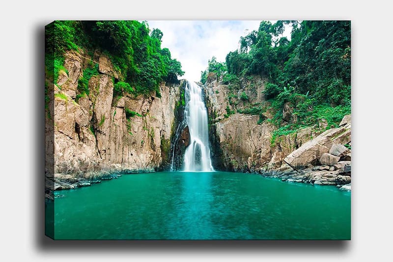 Canvas taulu 70x100 cm - Upea vesiputous, joka laskeutuu kirkkaaseen, turkoosiin järveen rehevien vihreiden kallioiden ympäröimänä, Turkoosi / Vihreä / Beige