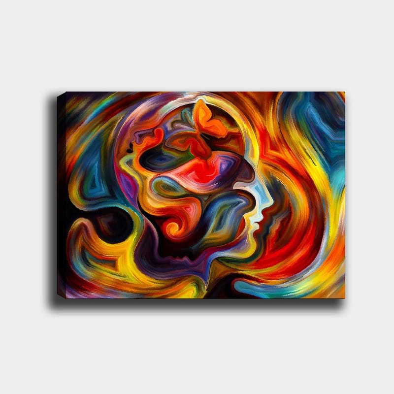 Canvas taulu 70x100 cm - Värikäs ja abstrakti kuvaus henkilön profiilista, jossa on perhosen elementtejä, jotka symboloivat muutosta ja vapautta, Punainen / Oranssi / Sininen