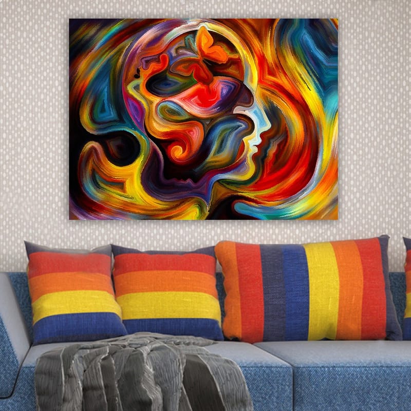 Canvas taulu 70x100 cm - Värikäs ja abstrakti kuvaus henkilön profiilista, jossa on perhosen elementtejä, jotka symboloivat muutosta ja vapautta - Punainen / Oranssi / Sininen - Sisustustuotteet - Taulu & taide - Canvas-taulu