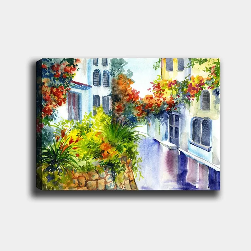 Canvas taulu 70x100 cm - Värikäs katu kukkien ja vehreyden keskellä Välimeren ympäristössä, Vihreä / Punainen / Sininen