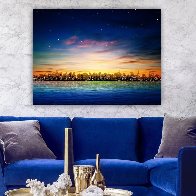 Canvas taulu 70x100 cm - Värikäs kaupunkinäkymä auringonlaskun aikaan ja heijastukset vedessä - Tummansininen / Oranssi / Vaaleanvihreä - Sisustustuotteet - Taulu & taide - Canvas-taulu