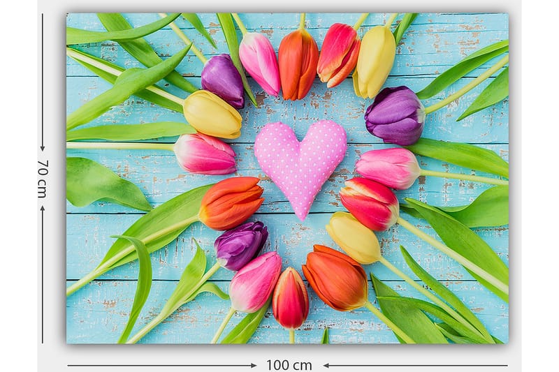 Canvas taulu 70x100 cm - Värikäs kokoelma sydämen muotoisia tulppaaneja, joiden keskellä on vaaleanpunainen koriste - Vaaleanpunainen / Violetti / Oranssi - Sisustustuotteet - Taulu & taide - Canvas-taulu