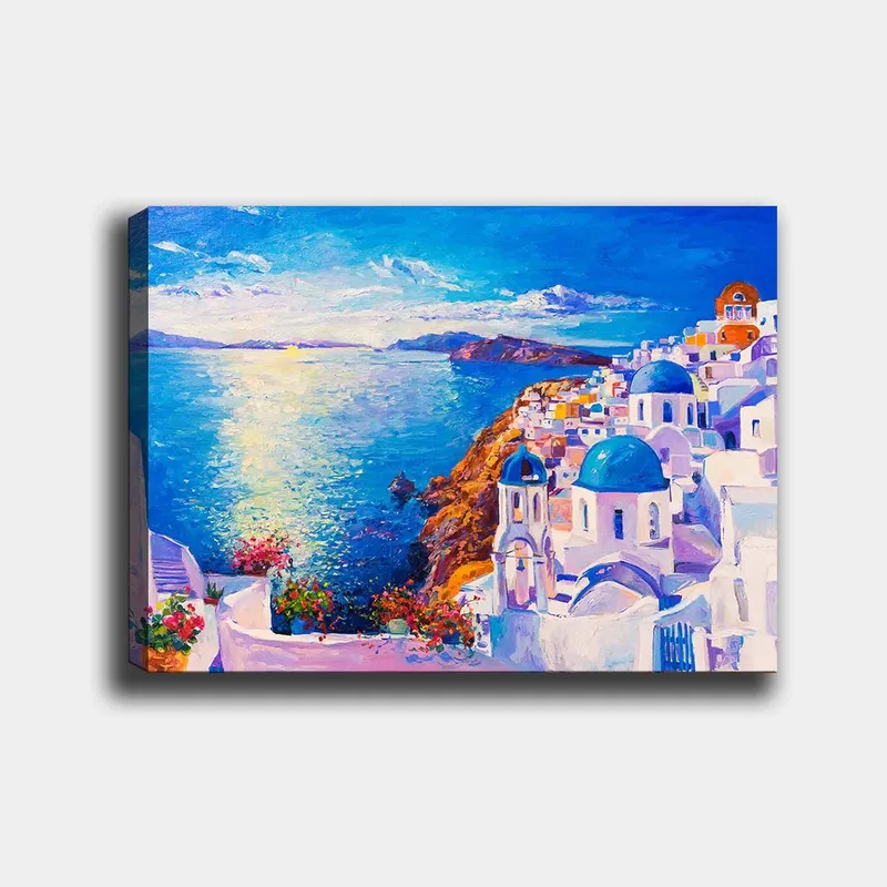 Canvas taulu 70x100 cm - Värikäs näkymä kreikkalaisesta rannikkokaupungista, jossa valkoiset rakennukset ja siniset kupolit kurottavat kohti merta, Sininen / Valkoinen / Oranssi