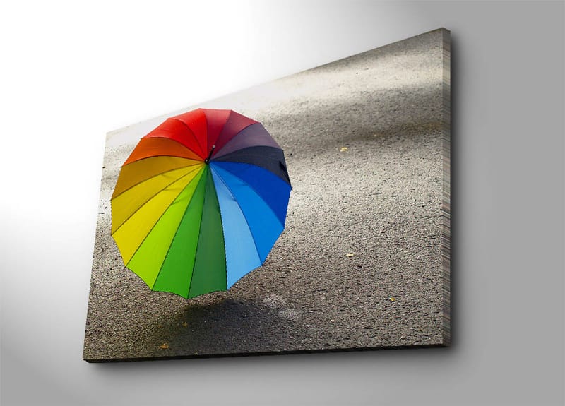Canvas taulu 70x100 cm - Värikäs sateenvarjo harmaalla pinnalla, Punainen / Vihreä / Sininen