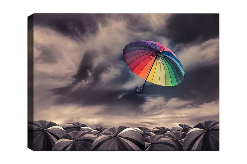 Canvas taulu 70x100 cm - Värikäs sateenvarjo leijuu harmaiden sateenvarjojen yllä dramaattisen pilvisen taivaan alla, Sateenkaaren värit / Harmaa
