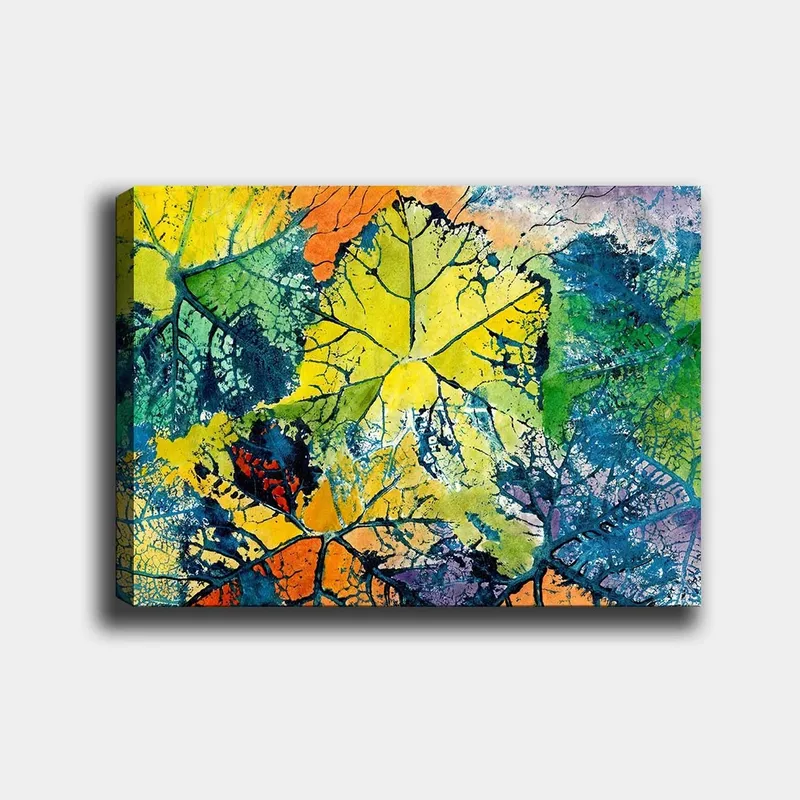 Canvas taulu 70x100 cm - Värikkäät lehdet eri sävyissä, jotka luovat eloisan ja abstraktin sommitelman, Keltainen / Vihreä / Oranssi