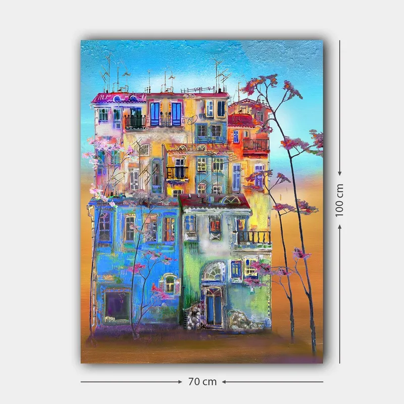 Canvas taulu 70x100 cm - Värikkäitä taloja kaupunkiympäristössä kukkivien puiden etualalla - Sininen / Vihreä / Oranssi - Sisustustuotteet - Taulu & taide - Canvas-taulu