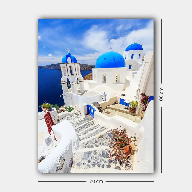 Canvas taulu 70x100 cm - Viehättävä näkymä valkoisista taloista sinisine kupoleineen ja päällystetystä tiestä kreikkalaisella saarella - Sininen / Valkoinen - Sisustustuotteet - Taulu & taide - Canvas-taulu
