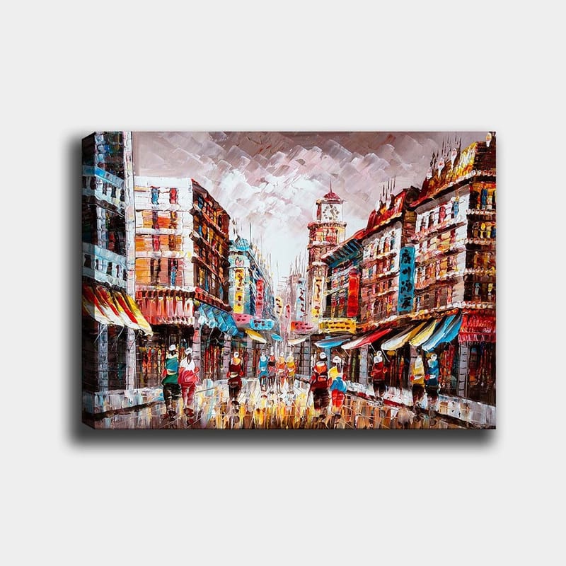 Canvas taulu 70x100 cm - Vilkas kaupunkikuva värikkäine rakennuksineen ja sateisella kadulla kävelevine ihmisineen, Punainen / Sininen / Keltainen
