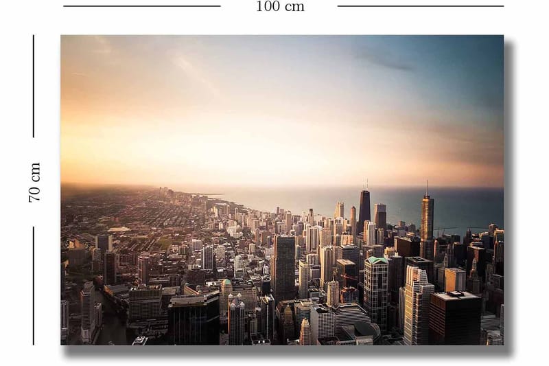 Canvas taulu 70x100 cm - Panoraamanäkymä kaupunkiin korkeine pilvenpiirtäjineen ja dramaattisen tunnelman luovalla auringonlaskulla - Sininen / Oranssi / Harmaa - Sisustustuotteet - Taulu & taide - Canvas-taulu