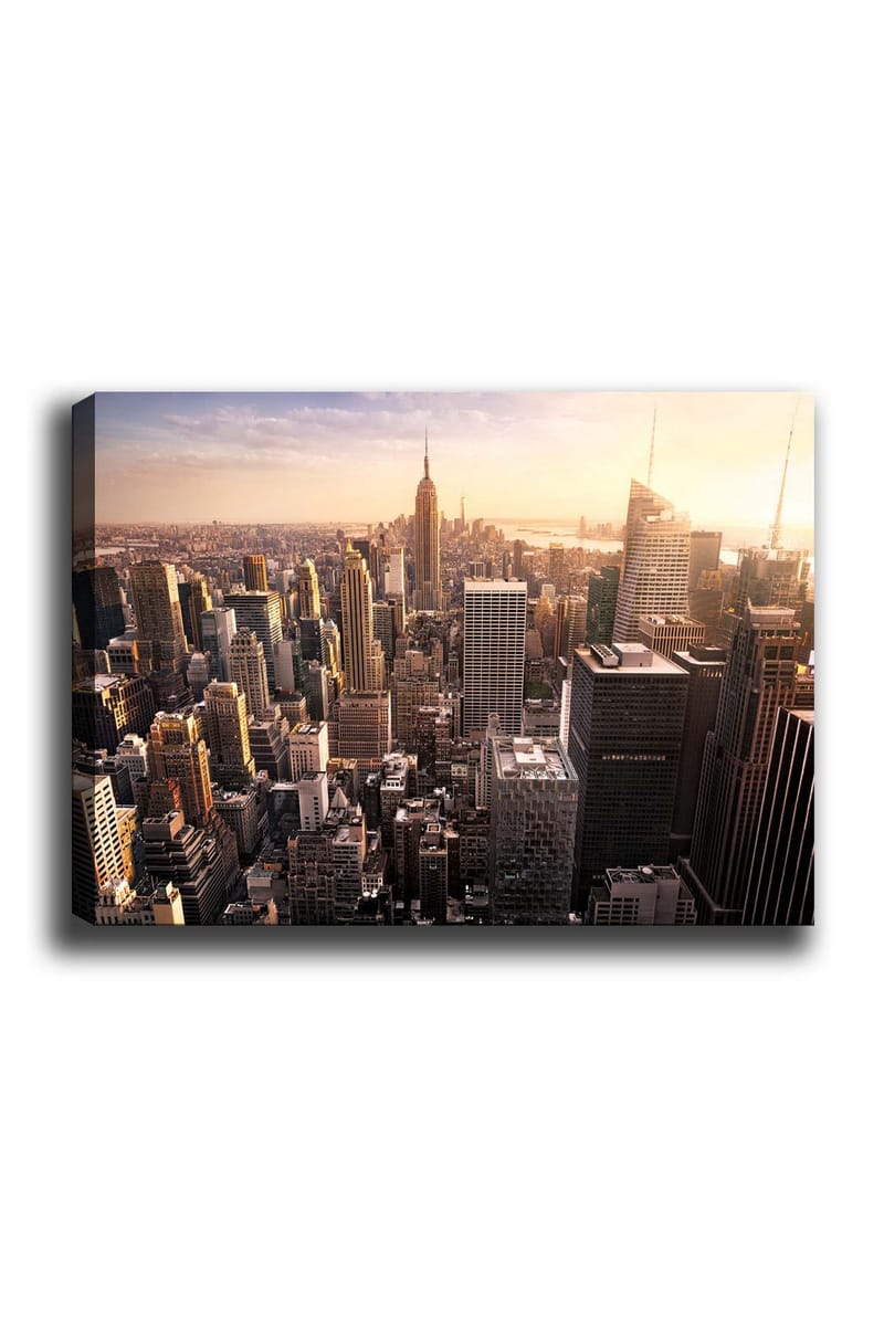 Canvas taulu 70x100 cm - Panoraamanäkymä kaupunkiin pilvenpiirtäjineen ja ikoniseen Empire State Buildingiin auringonlaskun aikaan, Kulta / Harmaa / Sininen