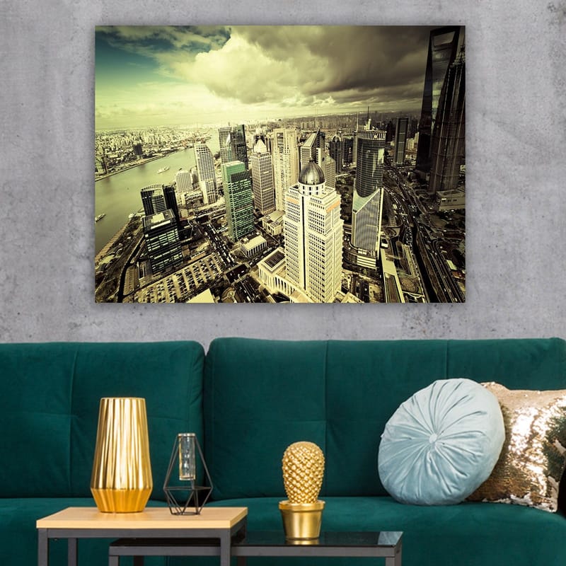 Canvas taulu 70x100 cm - Panoraamanäkymä modernista kaupungista korkeine pilvenpiirtäjineen ja maiseman läpi virtaava jokineen - Vihreä / Harmaa / Beige - Sisustustuotteet - Taulu & taide - Canvas-taulu