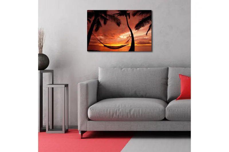 Canvas-taulu 70x45 cm - Auringonlasku meren yllä riippumatossa palmujen välissä - Oranssi / Musta / Punainen - Sisustustuotteet - Taulu & taide - Canvas-taulu