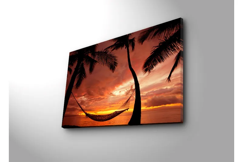 Canvas-taulu 70x45 cm - Auringonlasku meren yllä riippumatossa palmujen välissä - Oranssi / Musta / Punainen - Sisustustuotteet - Taulu & taide - Canvas-taulu