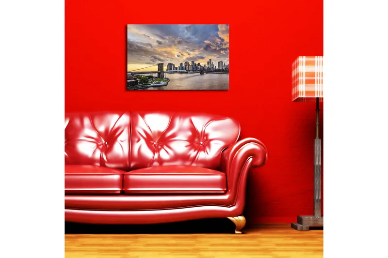 Canvas-taulu 70x45 cm - Kaupungin siluetti auringonlaskussa veden yllä, Sininen / Oranssi / Harmaa