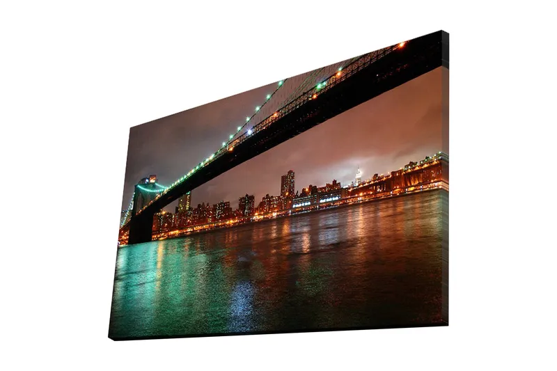 Canvas-taulu 70x45 cm - Silta kaupungin yli heijastuksineen vedessä, Tummanvihreä / Oranssi / Musta