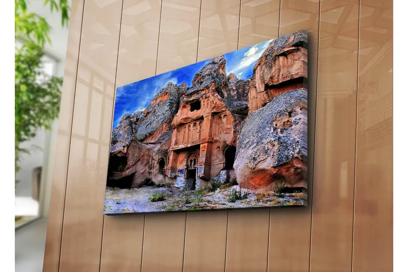 Canvas-taulu 70x45 cm - Upea kalliomuodostelma historiallisine rakennuksineen, Terrakotta / Harmaa / Sininen