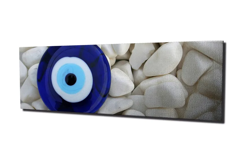 Canvas-taulu 80x30 cm - Sinivalkoinen silmä valkoisten kivien taustaa vasten - Sininen / Valkoinen / Musta - Sisustustuotteet - Taulu & taide - Canvas-taulu